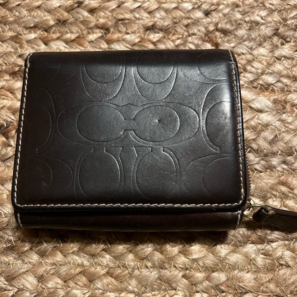 Small vintage signature Coach leather wallet in chocolate brown.